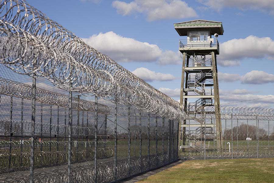 2-prison-fence-watch-tower-and-barbed-roberto-westbrook.jpg